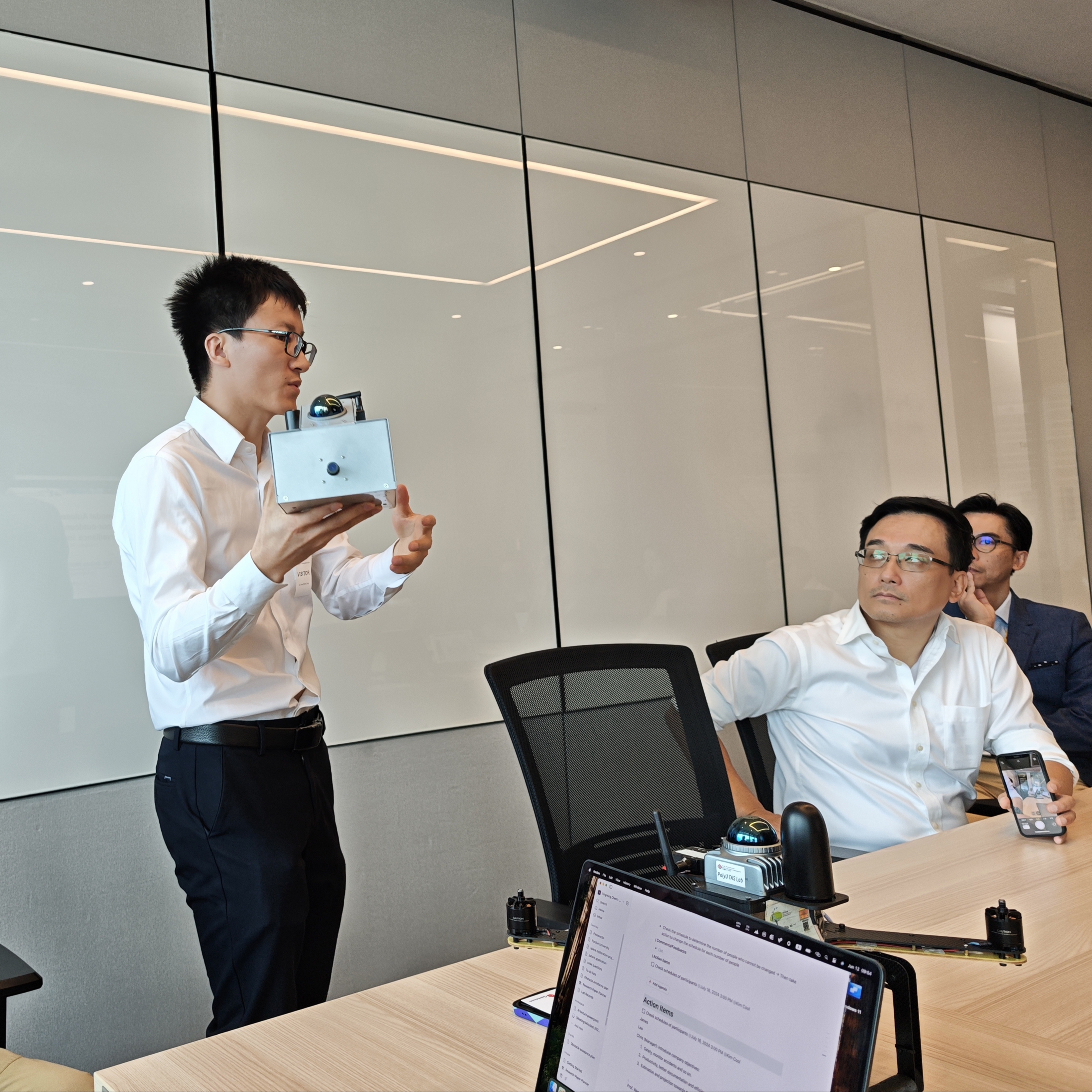 Professor Wen explains the handheld mapping system.